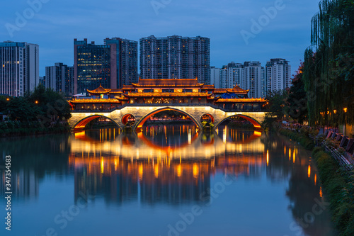Anshun bridge at night surrounded by modern building in Chengdu city, Sichuan, China