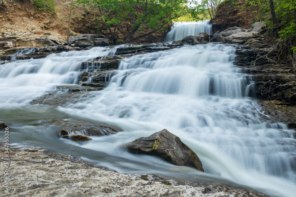 Naklejka premium Small waterfall in the forest