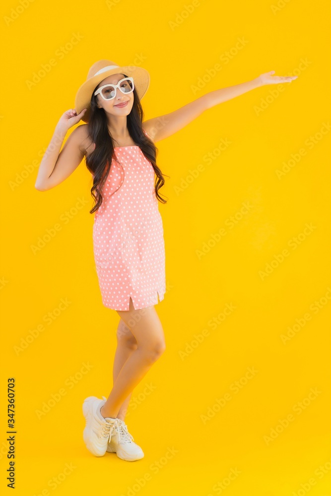 Portrait beautiful young asian woman smile happy relax on yellow isolated Portrait beautiful young asian woman smile happy relax on yellow isolated