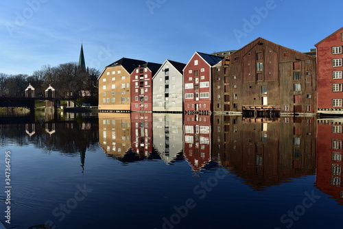 Photography background of colourful storehouse and reflection near Nidelva river T rondheim
