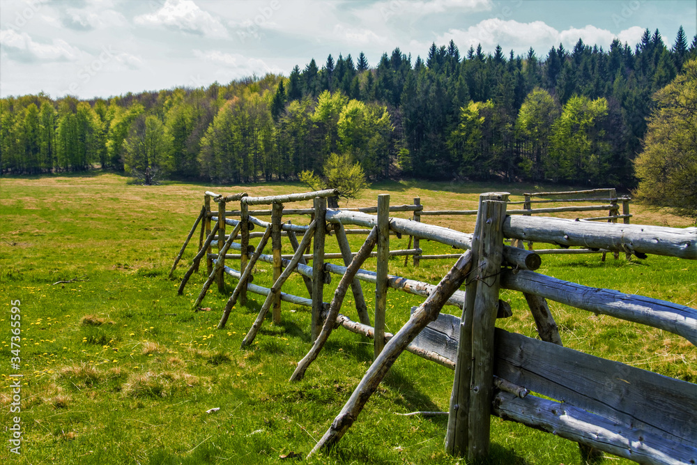 an old wooden fence in the field