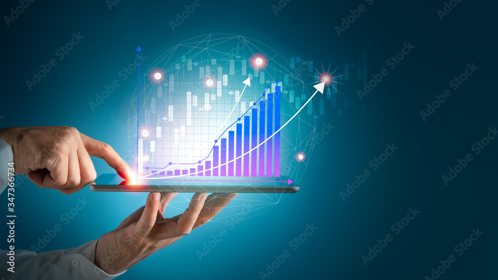 Businessman using tablet and technology. Digital marketing of Sales and Economic growth graph chart. Businessman using tablet and technology. Digital marketing of Sales and Economic growth graph chart.