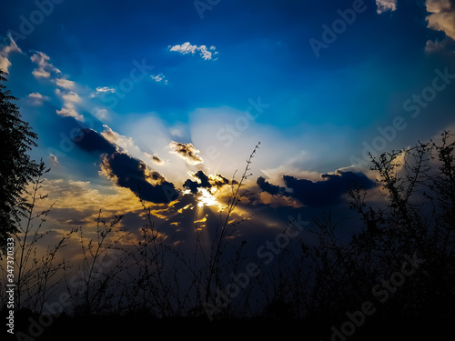 beautiful dramatic black clouds at sunset time