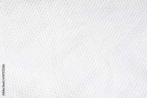 White mesh jersey fabric background. cloth sport wear texture for exercise. light weight, good air flow, cool and easy to dry from sweat. abstract wallpaper with copy space for text.