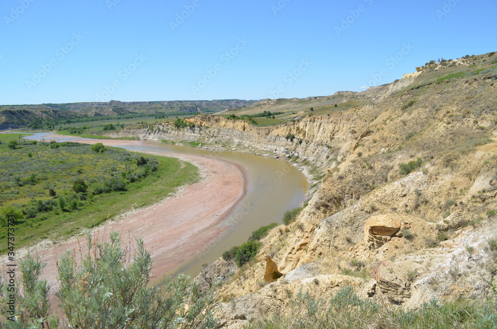 Late Spring in the North Dakota Badlands: Looking Downstream Toward Jules Creek on the Little Missouri River from the Wind Canyon Trail in the South Unit of Theodore Roosevelt National Park Late Spring in the North Dakota Badlands: Looking Downstream Toward Jules Creek on the Little Missouri River from the Wind Canyon Trail in the South Unit of Theodore Roosevelt National Park