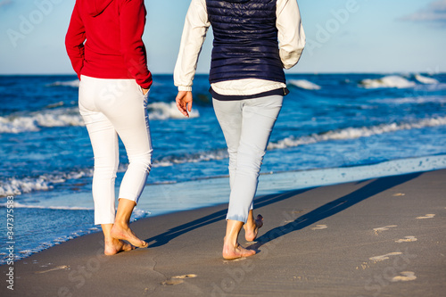 Women walking on beach  © Jacek Chabraszewski