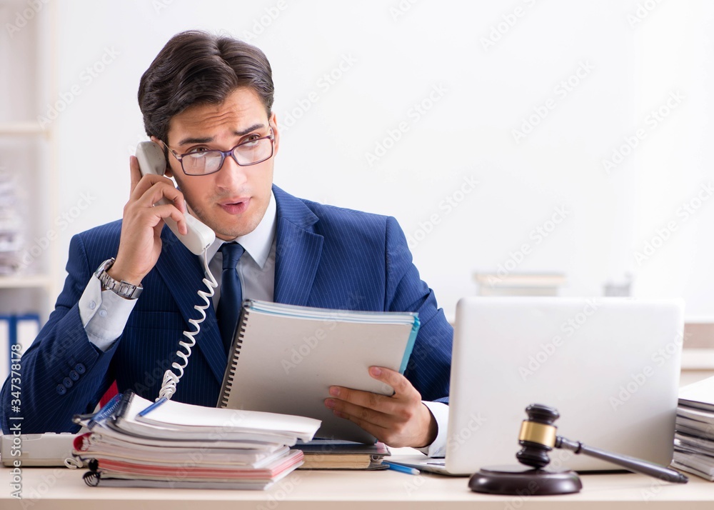 Young handsome judge working in court Young handsome judge working in court