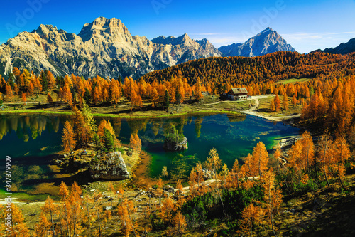 Spectacular Federa lake in the autumn forest, Dolomites, Italy