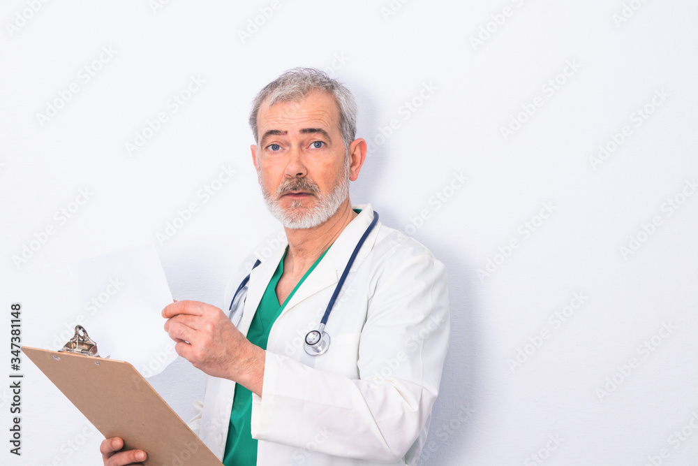 adult or senior doctor with beard and stethoscope isolated on white adult or senior doctor with beard and stethoscope isolated on white