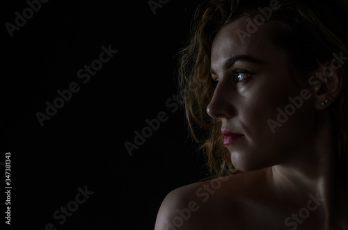 Silhouette portrait of a girl isolated on a dark background