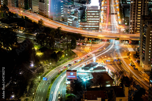 Night city roads with a lot of traffic and light trail – view from skyscrapers © AP