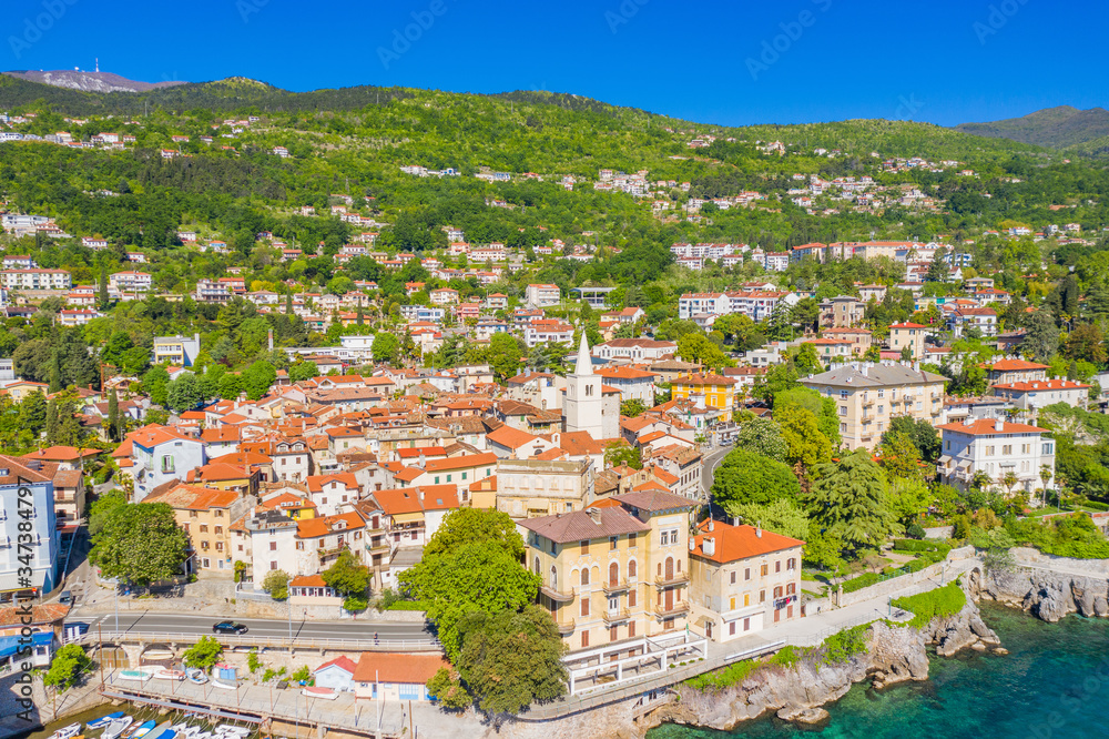 Croatia, beautiful town of Lovran and sea walkway, aerial panoramic view in Kvarner bay coastline, popular tourist destination