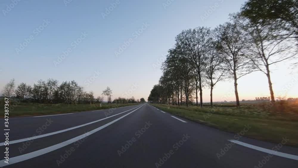 POV, Driving Plate - car driving on a countryside main road in The Netherlands on a sunny spring or summer day. POV, Driving Plate - car driving on a countryside main road in The Netherlands on a sunny spring or summer day.