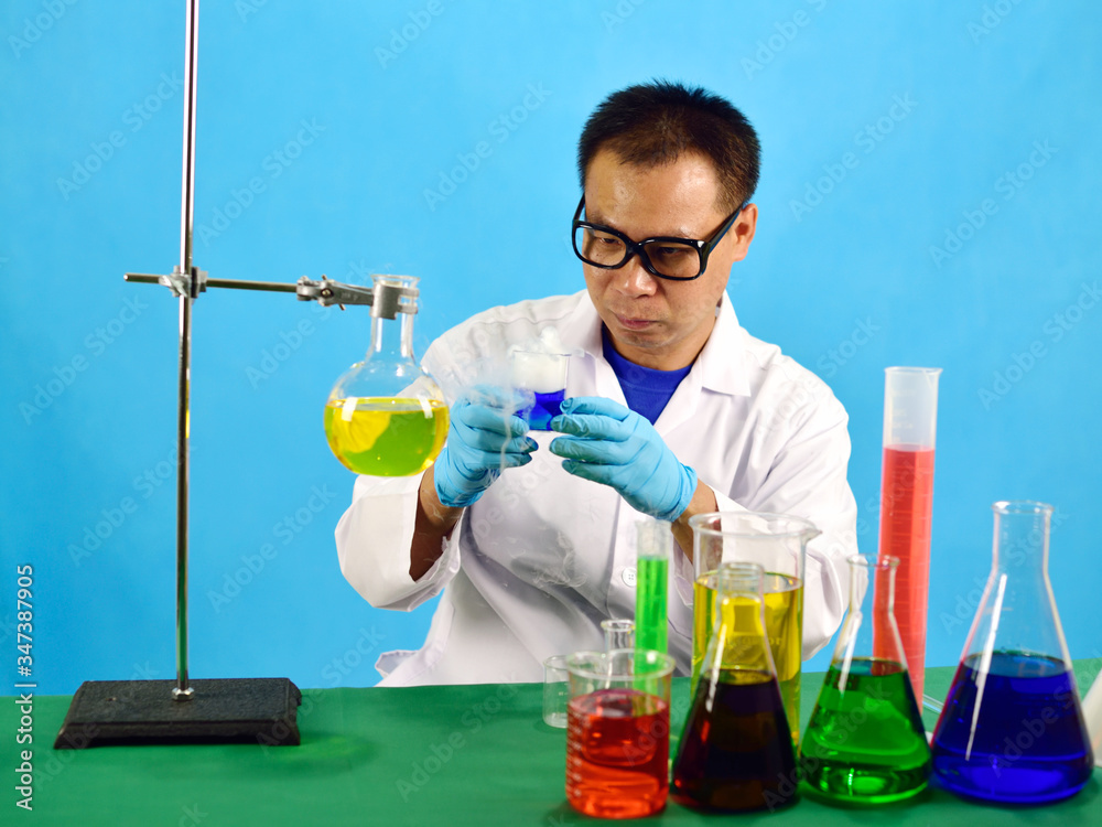 Asian man scientist working with chemical in research laboratory Asian man scientist working with chemical in research laboratory