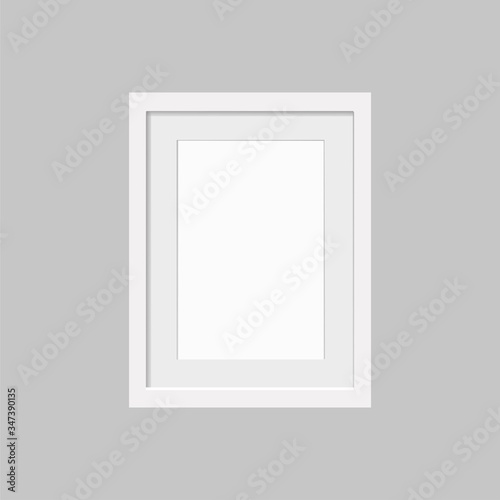 Realistic empty white frame with passepartout isolated on gray background. Border for your creative project, mock-up sample, vector design object.