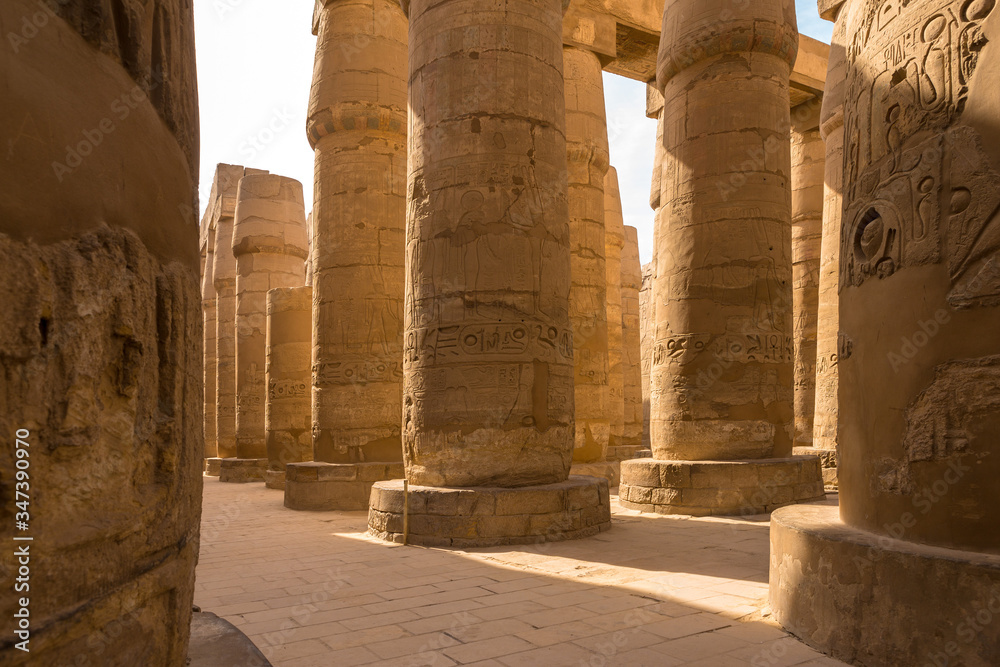 Karnak Temple, The ruins of the temple, Embossed hieroglyphs on the wall Karnak Temple, The ruins of the temple, Embossed hieroglyphs on the wall