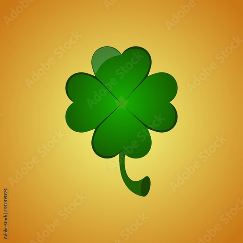 Four leaf clover on orange background. Greeting card for St. Patrick's Day.