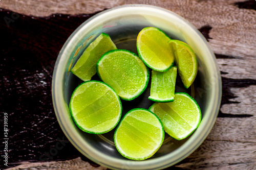 Background of sliced lemons, put in a clean container, for use as part of food seasoning (Guay Tiao menu). Add sour taste. photo