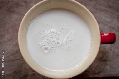 Background of fresh coconut milk from coconut, put in a cup to cook a variety of food (desserts, spicy local food)
