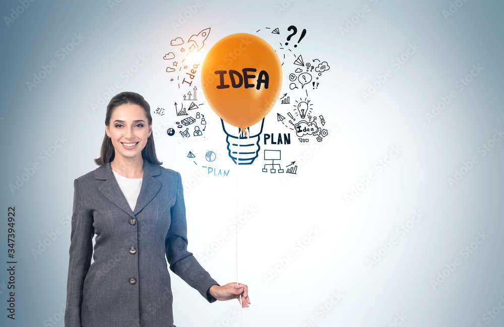 Woman with orange balloon and her business idea Woman with orange balloon and her business idea