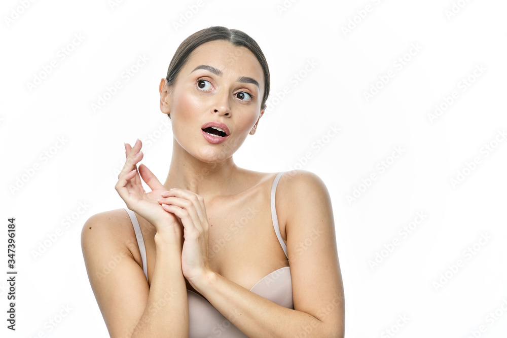 Beautiful smiling woman with clean skin, natural make-up, and white teeth on white background Beautiful smiling woman with clean skin, natural make-up, and white teeth on white background
