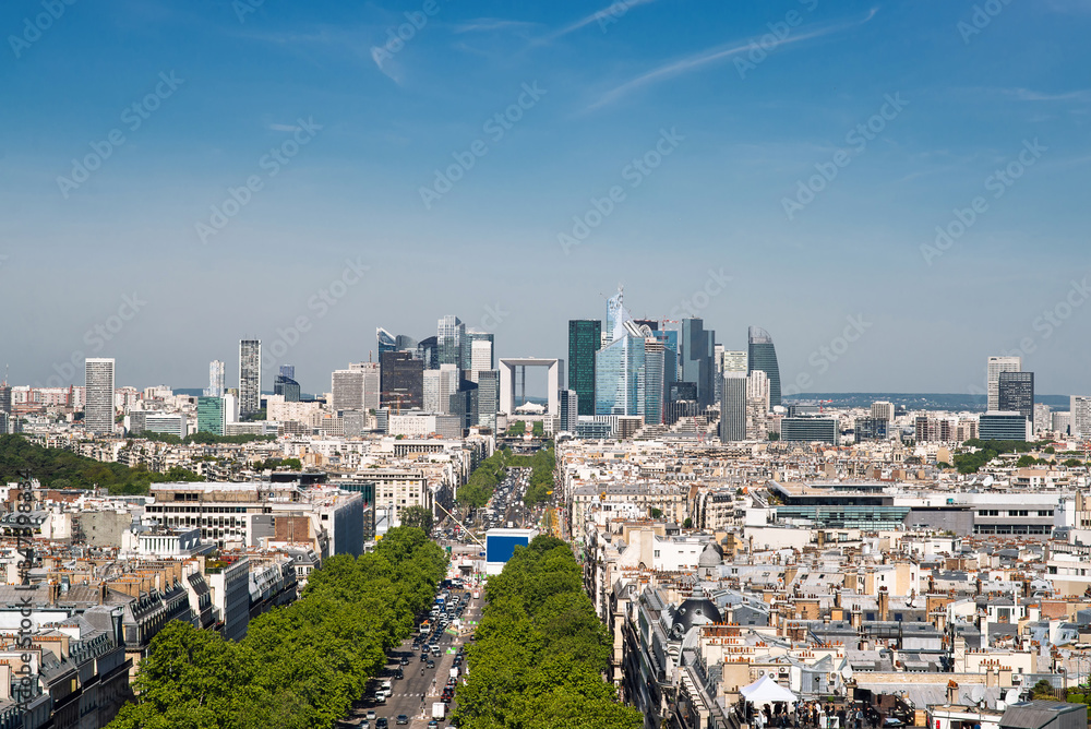 Obraz premium La Defense Financial District in Paris France. Traffic on La Grande Armee Avenue with Green Trees Aside.