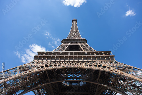 Eiffel Tower in Paris on Blue Sky Background. France. Bottom View. © BooblGum
