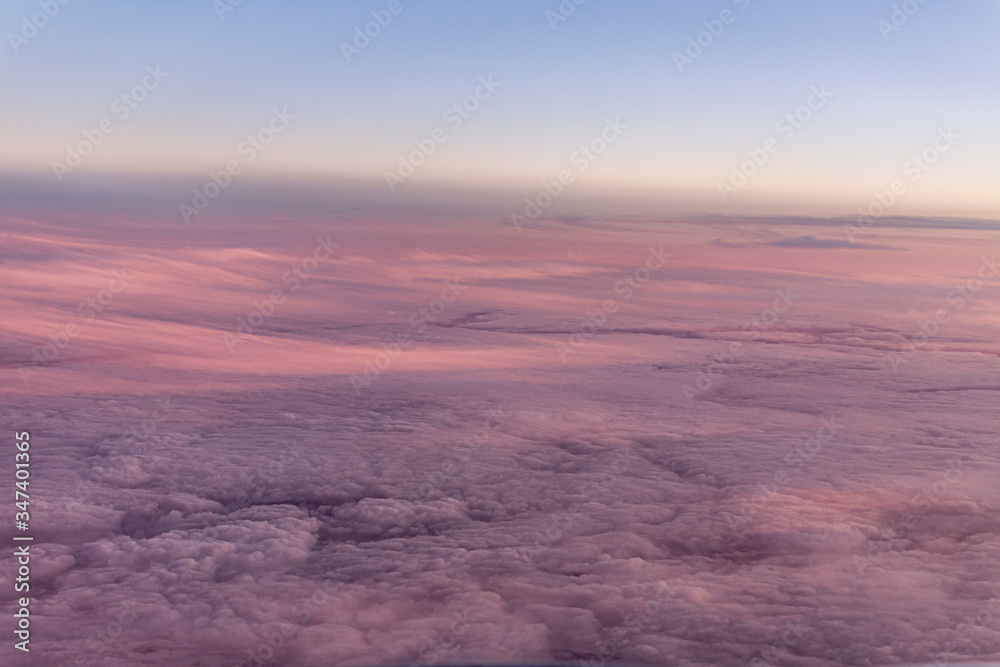 Soft flat purple clouds from plane window