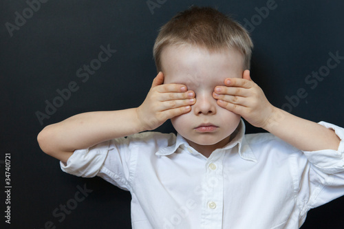 Fear children hand cover face, imprison, retarded,  Background, slave. photo