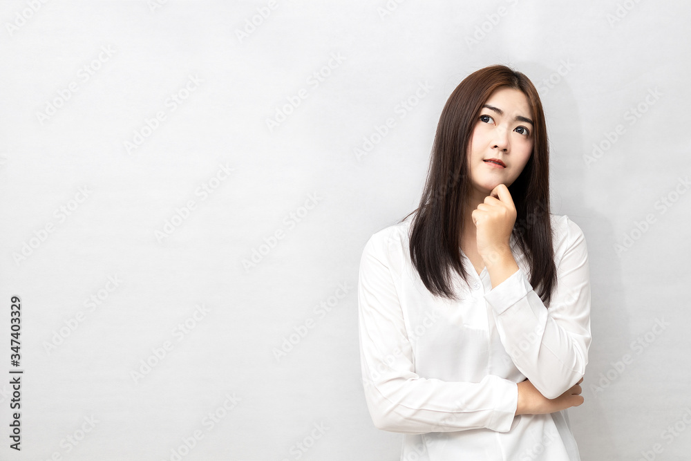 Long-haired Asian women are standing thinking isolated on white background. Long-haired Asian women are standing thinking isolated on white background.
