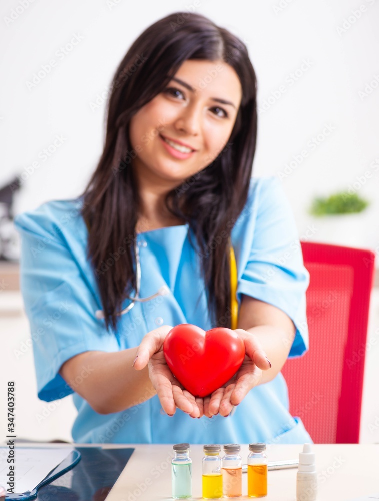 Young beautiful female doctor working in the clinic Young beautiful female doctor working in the clinic