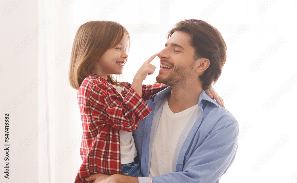 Portrait of father and daughter bonding over white background Portrait of father and daughter bonding over white background