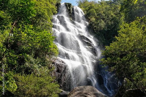 Fototapeta Naklejka Na Ścianę i Meble -  Scenic waterfall in tropical Atlantic forest, motion blur, Serra da Mantiqueira, Brazil
