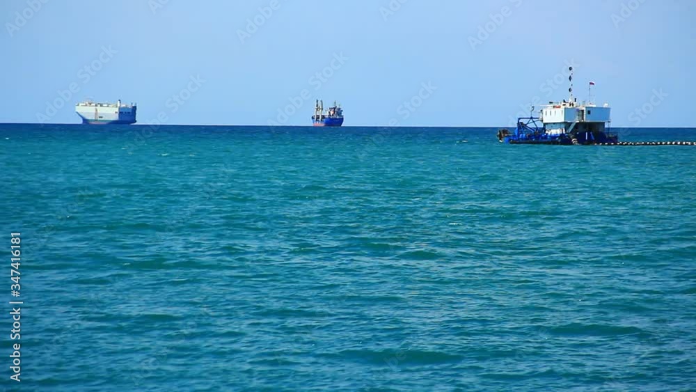Big trans Atlantic ships far away on open sea, waiting to leave the port. Big trans Atlantic ships far away on open sea, waiting to leave the port.