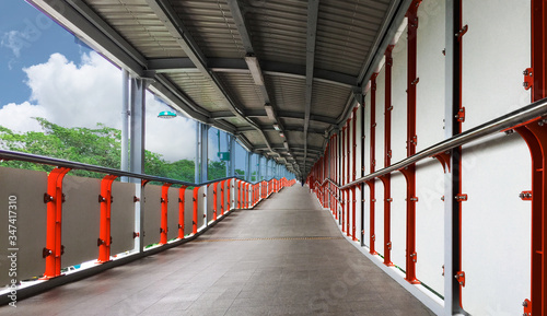 Tableau sur toile Sky walk bridge links to the bts sky train as modern transportation networks in Bangkok, Thailand