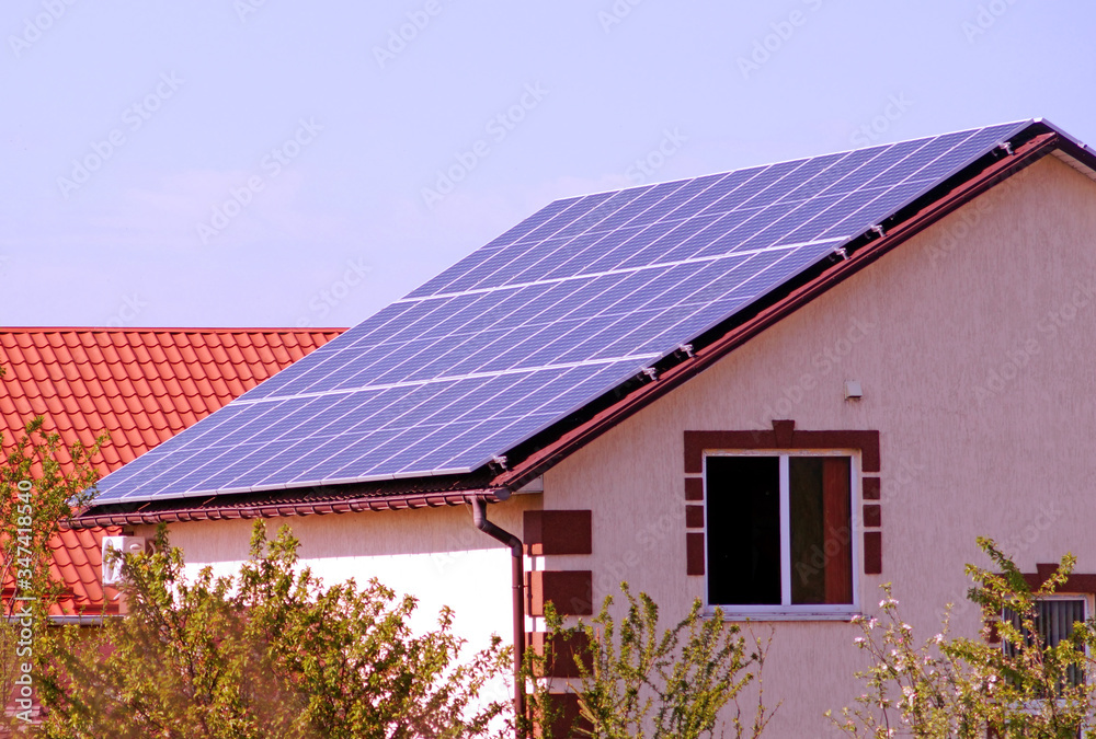 Solar panels on the roof of house.