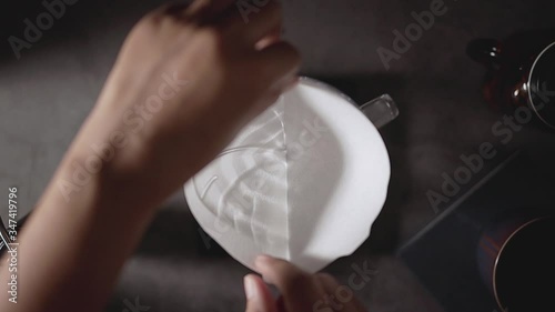 Coffee Drip Concept. Shot of Preparing Paper Filter to Making Hot Coffee Drink in House. Zen and Cozy Living. Top View