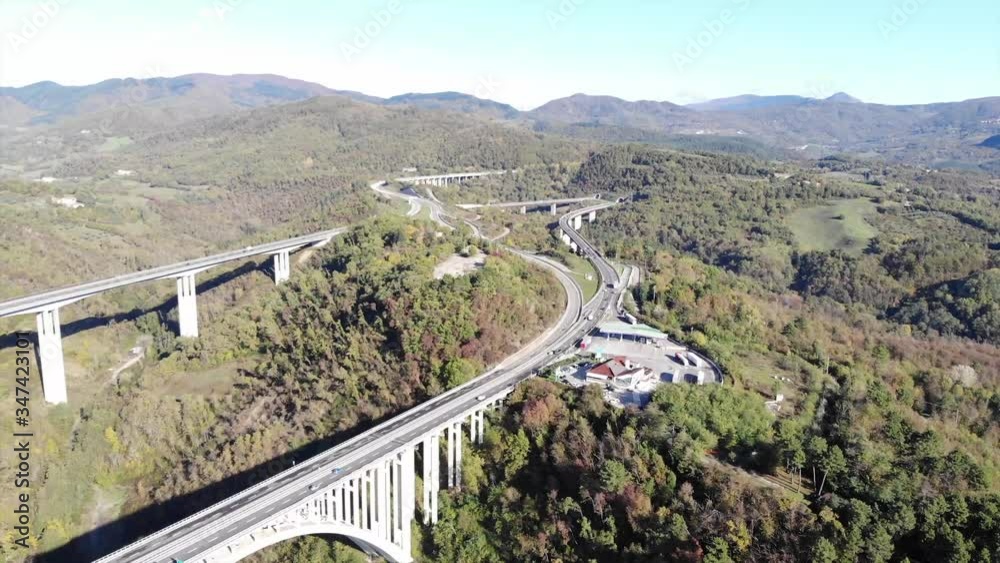 Top view of Cinema 4k on a huge bridge, between the mountains, on a sunny autumn day. Top view of Cinema 4k on a huge bridge, between the mountains, on a sunny autumn day.