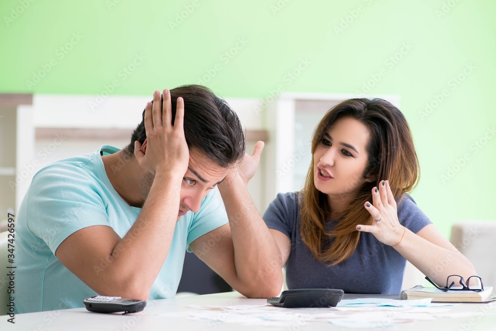 Fototapeta premium Young family struggling with personal finance