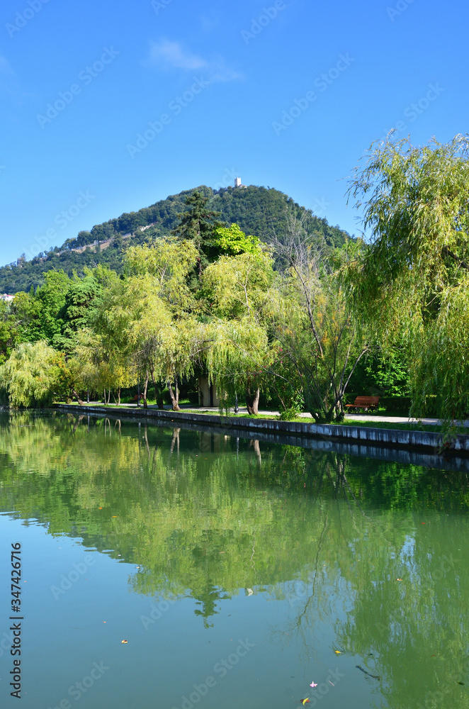New Athos, Abkhazia. Pond and city park in sunny August day