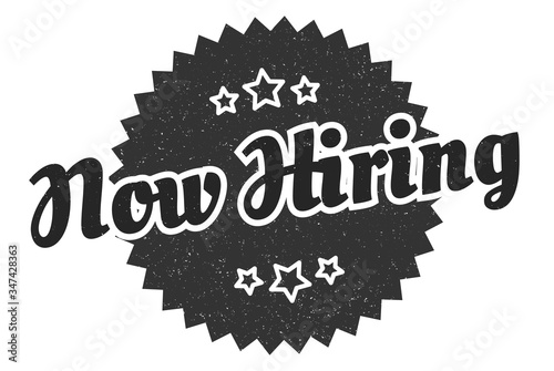 now hiring sign. now hiring round vintage retro label. now hiring