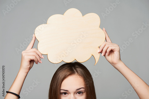 Tablou pe pânză Cropped woman face holding thinking bubble above