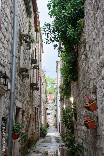 Narrow street with stone facades, in Ston, Dubrovnik Neretva county, located on the Peljesac peninsula, Croatia, Europe. photo