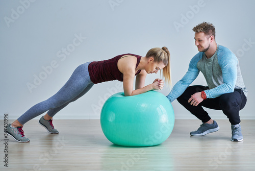 Woman with her personal fitness trainer