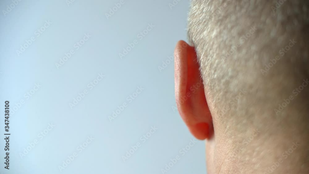 Male left ear moving close up. Back view man moving left ear. Human ...