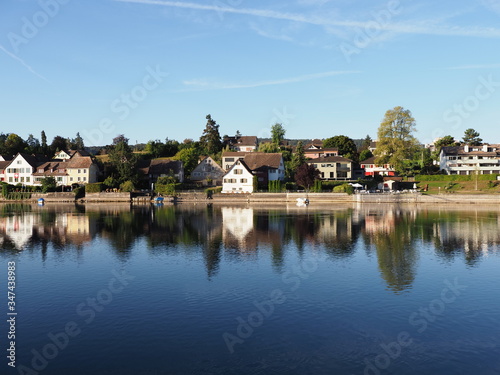 Houses reflected in Rhine River in STEIN am RHEIN town in Switzerland