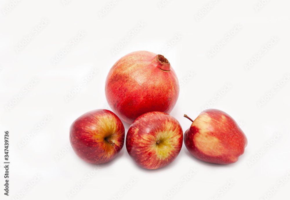 Red apple and Pomegranateon white background Red apple and Pomegranateon white background