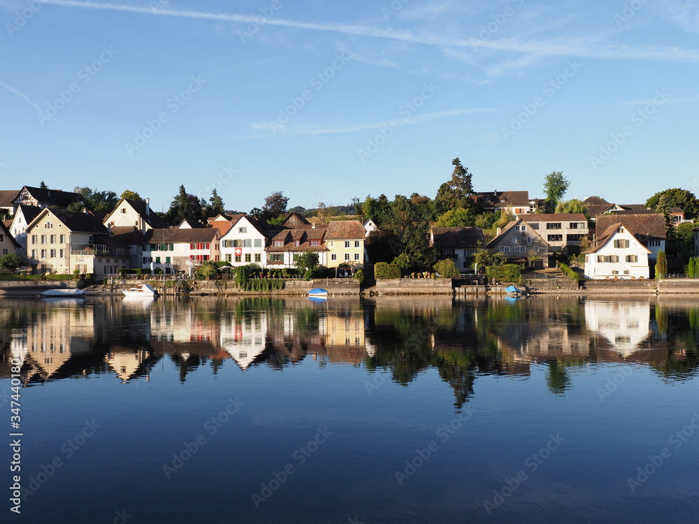 Buildings reflected in Rhine River in STEIN am RHEIN in Switzerland