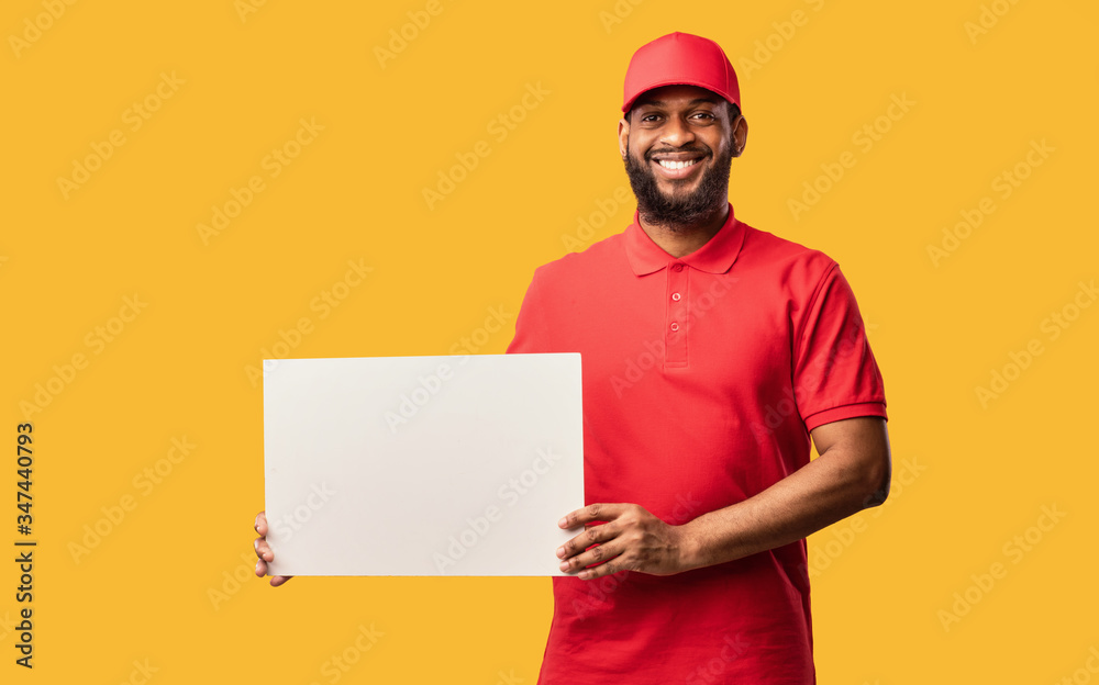 African Delivery Guy Showing Empty White Poster, Yellow Background, Mockup