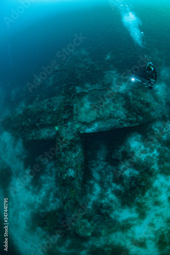 wreck of plane US Airforce P-47 thunderbolt upside down on a coral reef © Subphoto